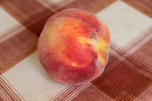 peach on a tablecloth