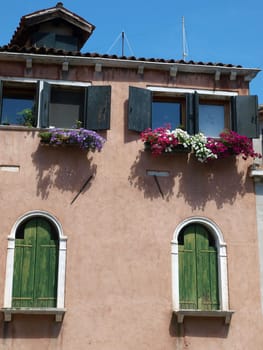 Venice - typical Venetian architecture, decorated with colorful flowers