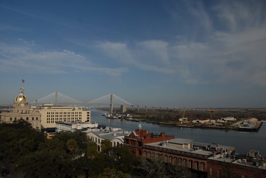 A view along the river in Savannah Georgia with the Talmadge Bridge in the background
