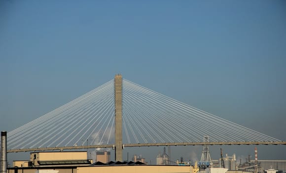 A view along the river in Savannah Georgia with the Talmadge Bridge in the background