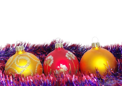 Christmas tinsel and toys on a white background