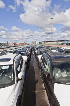 Large group of cars waiting for transport