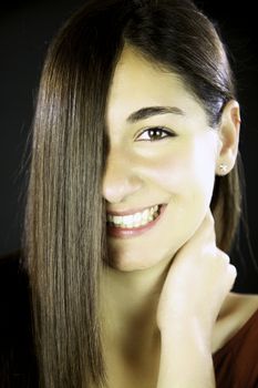 Young woman with gorgeous smile and amazing long straight hair