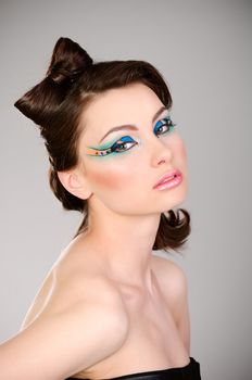 young beautiful woman with makeup studio shot