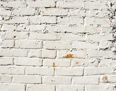 Background red brick wall painted white paint. Architectural backdrop.