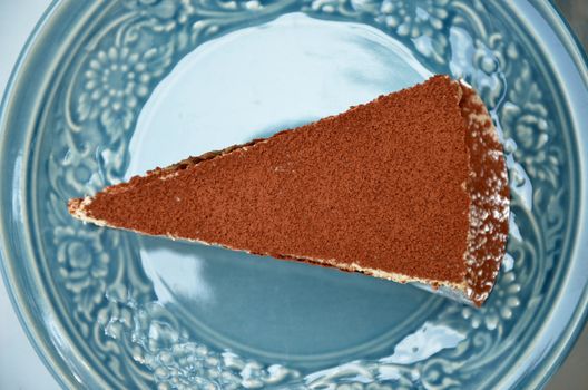 Tiramisu cake in the blue dish