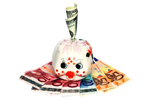 Piggy Bank with a hundred dollar bills in slot standing on the euro banknotes.