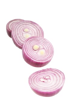 РЎhopped red onion circles. Isolated on white.