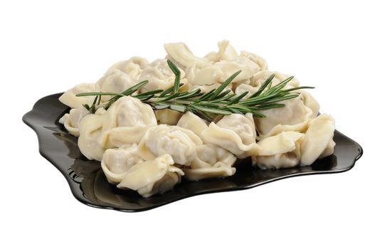 Ready to eat ravioli on a plate. Decorated with rosemary. Isolated on white.