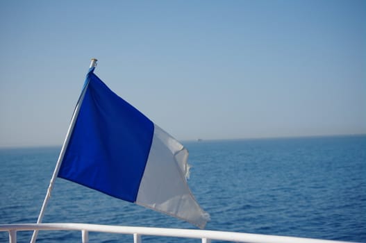 a flag on a boat in the red sea