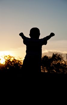 silhouette of children victory