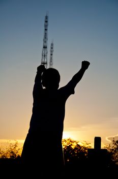 silhouette of boy victory