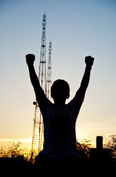 silhouette of boy victory and happy