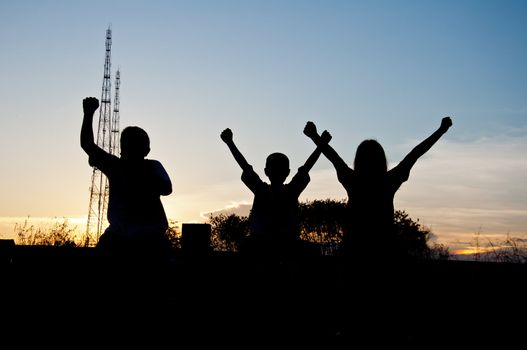 silhouette of children victory and happy