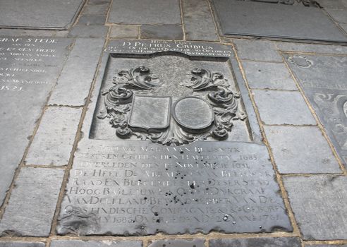 A plaque on the wall of the building, riddled with bullets. Delft,  Netherlands