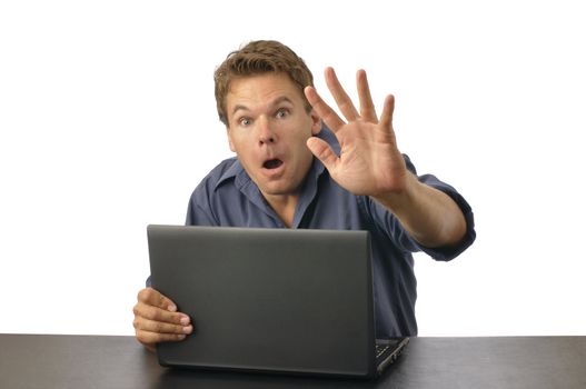 Man caught by surprise on computer raises hand to block view
