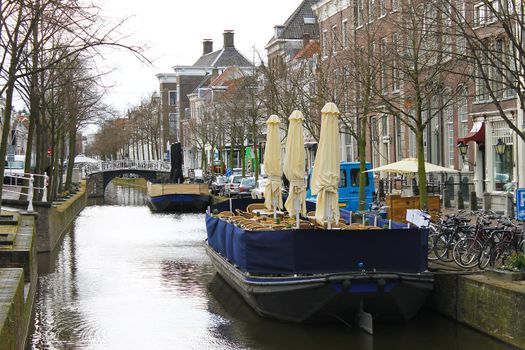 Restaurants on the canal of Delft in the early morning. Netherlands