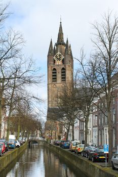 Canal and church tower in Delft, Netherlands