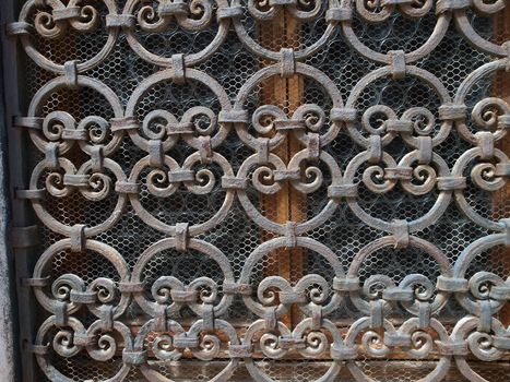 Hand made solid iron grille in the window