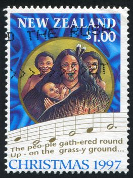 NEW ZEALAND - CIRCA 1997: stamp printed by New Zealand, shows Scenes from first Christian service, Rangihoua Bay, and words from Christmas carol, circa 1997