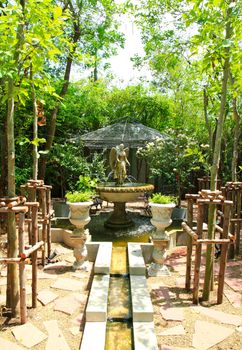 Angel sculpture fountain in the garden