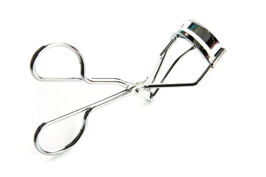 Eyelash curler on the white background