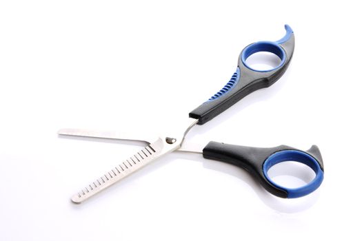 Hair scissors on the white background