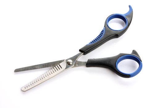 Hair scissors on the white background