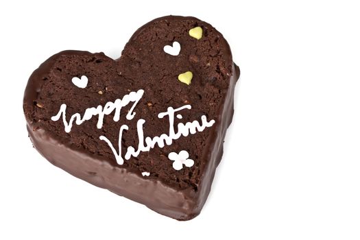 Heart shaped slice of a brownie on white background