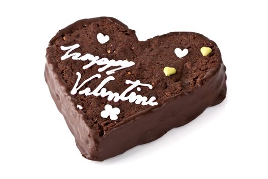 Heart shaped slice of a brownie on white background