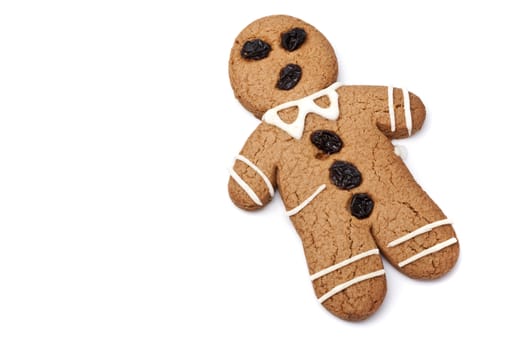 Gingerbread man on white background with copy space.