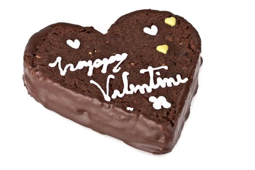 Heart shaped slice of a brownie on white background