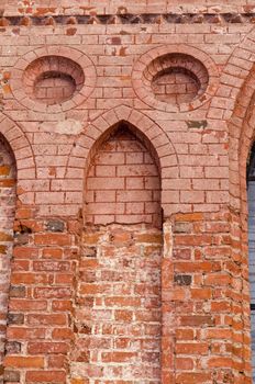 Ancient architecture grunge red brick building decorative wall background.