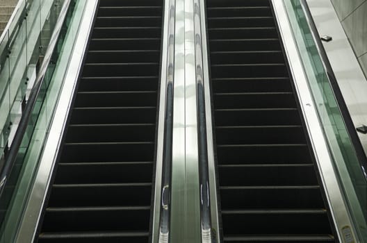 detail of modern glass and metal escalator