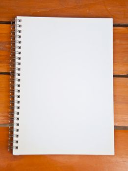 blank notebook on wood