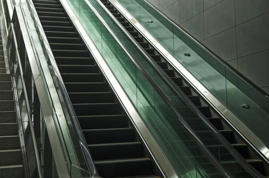 detail of modern glass and metal escalator