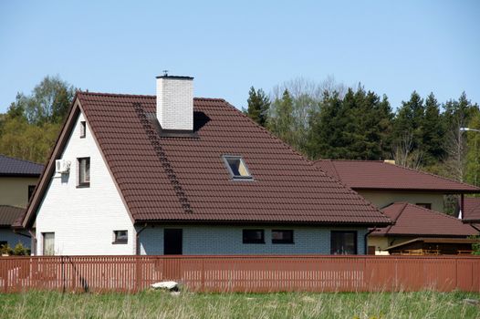 The modern house and brown fencing