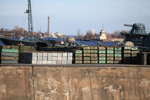 Boxes of ammunition at the pier before loading a warship
