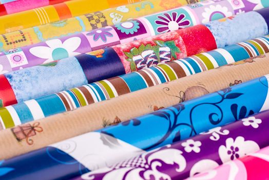 Rolls of colored wrapping paper.