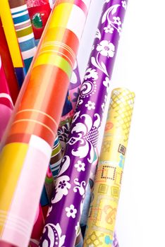 Rolls of colored wrapping paper.