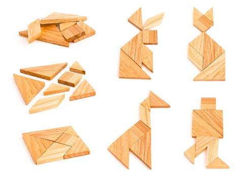 Isolated views of wooden tangram with few finished figures