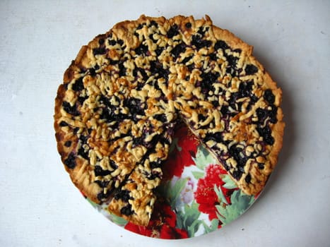 Fresh and tasty pie with bilberry isolated on the white background