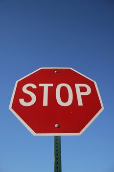 Stop Sign against blue sky background