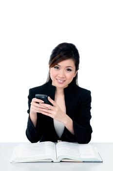 Portrait of an attractive young woman holding a mobile phone over white background.