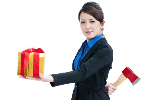 Businesswoman presenting a gift box infront and holding an axe behind her back, isolated on white.