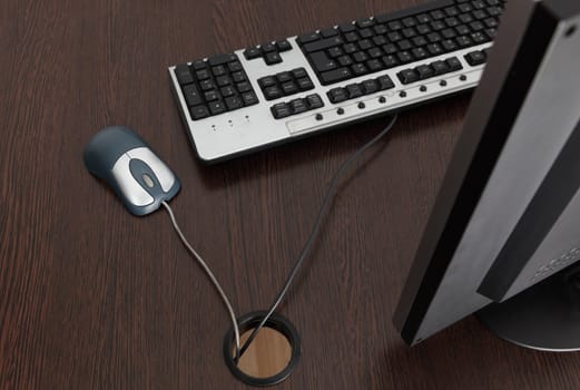 Upper view of an office desk with mouse and keyboard.