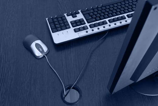 Upper view of an office desk with mouse and keyboard.