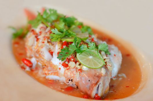 Steamed  fish with chili and  lemon ,  hot and spicy