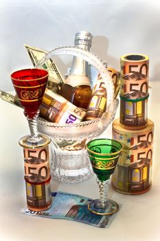 Money, wine, beautiful wine-glasses and vase for a table