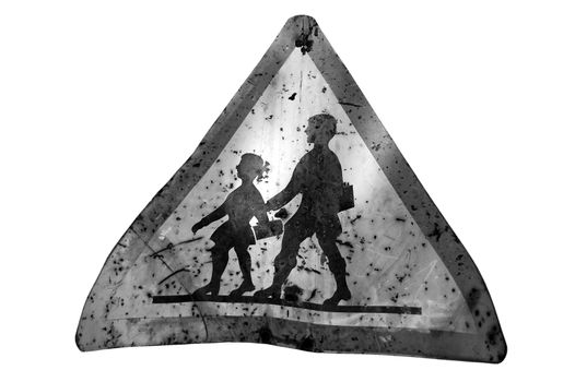 Rusty warning sign for school children. Black and white.